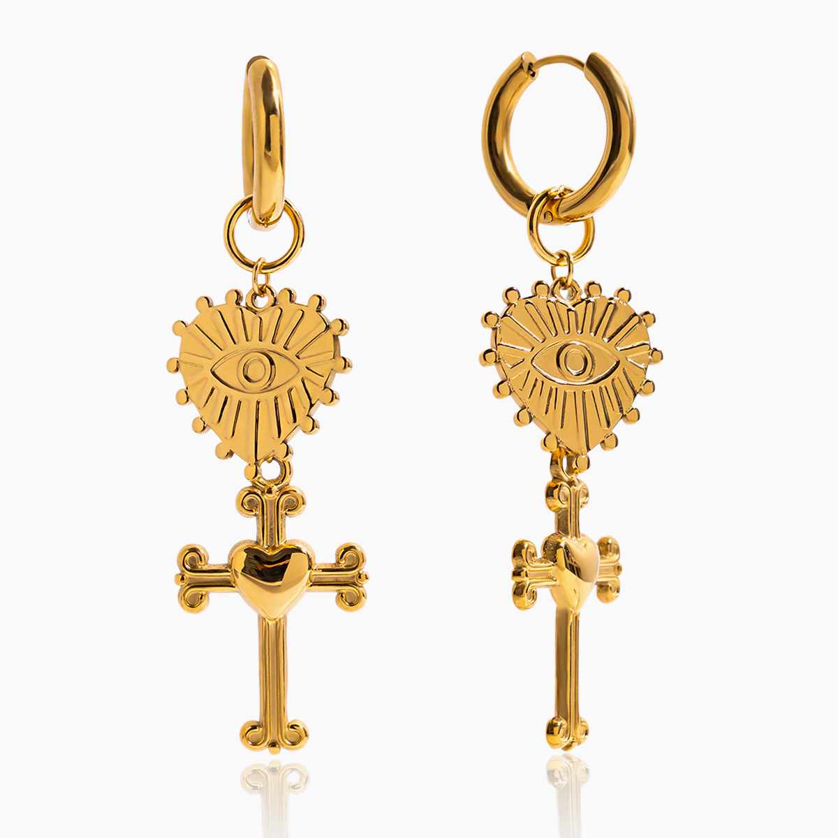 Gold hoop earrings with eye and cross designs on a white background
