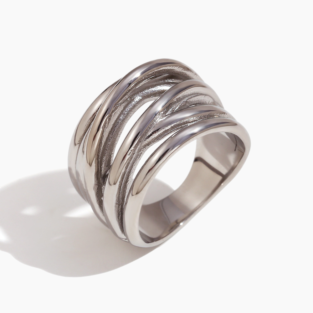 Silver ring with multiple bands on a white background