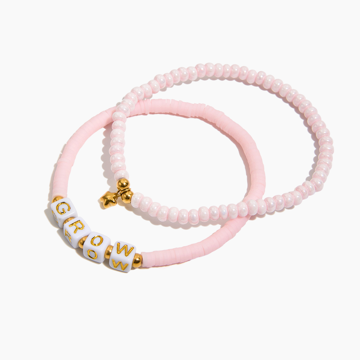 Two pink beaded bracelets with gold accents on a white background