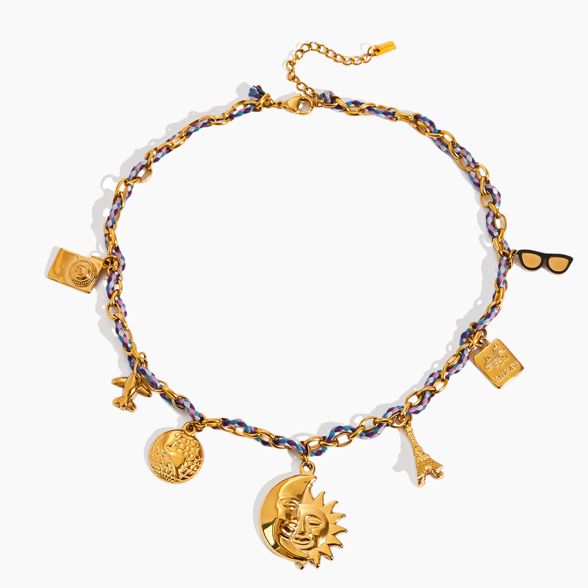 Gold bracelet with various charms on a white background