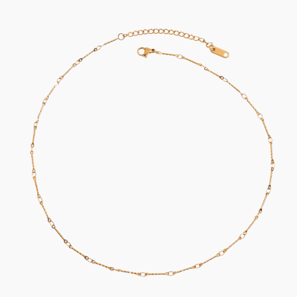 Gold chain necklace on a white background