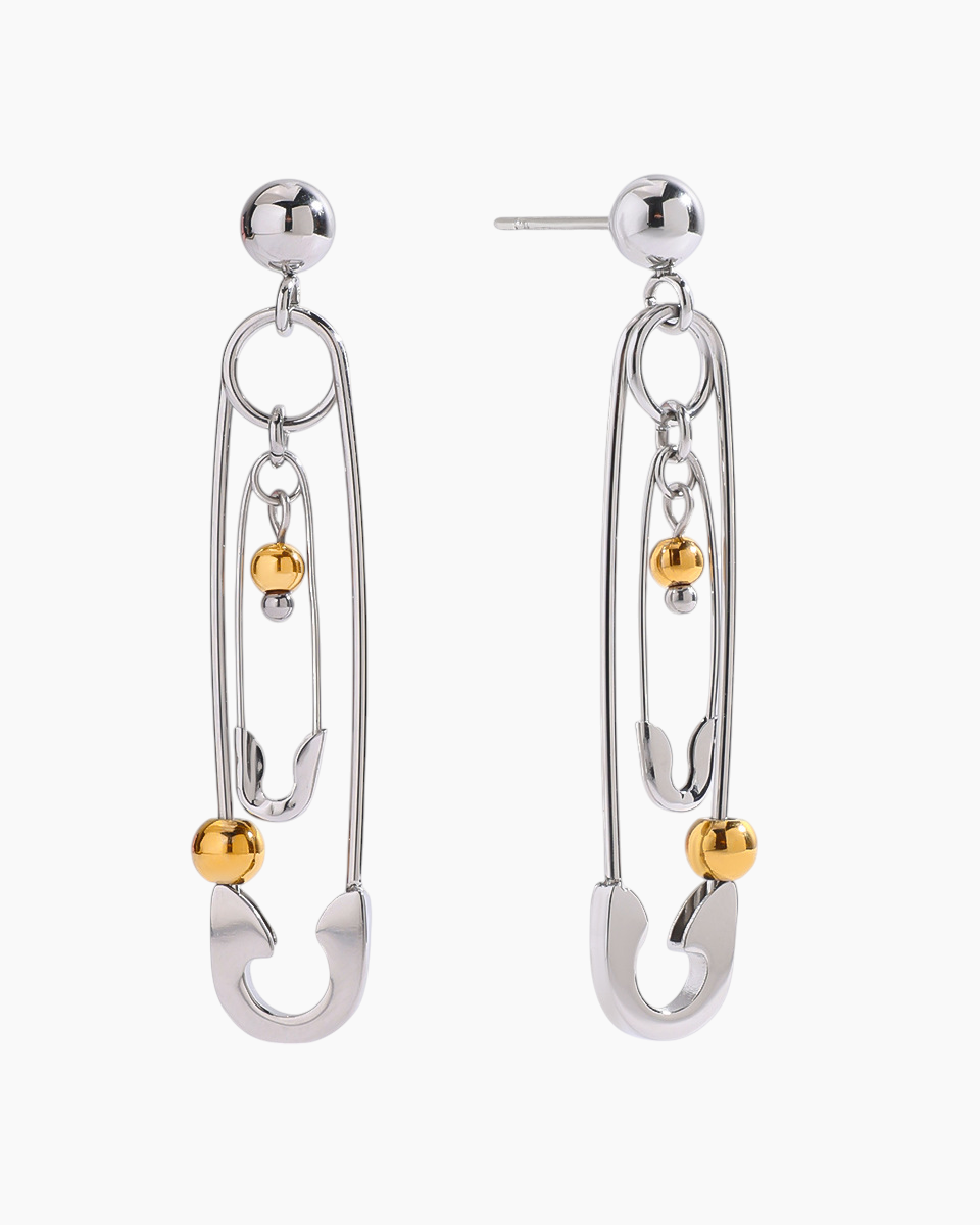 Silver earrings with gold accents on a white background