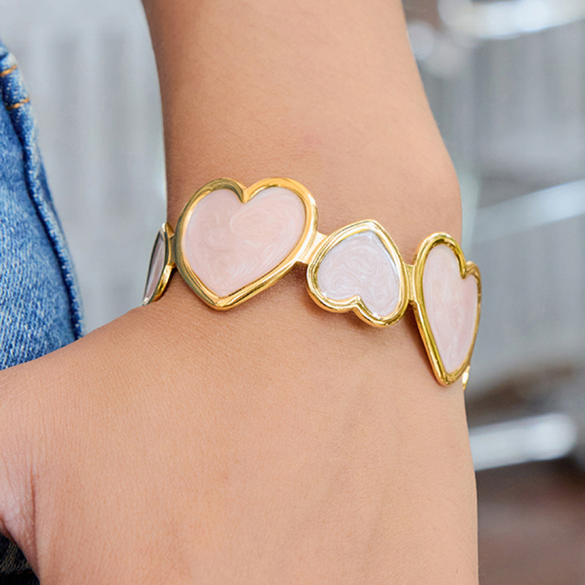 pink enamel heart bracelet stacked for casual outfit