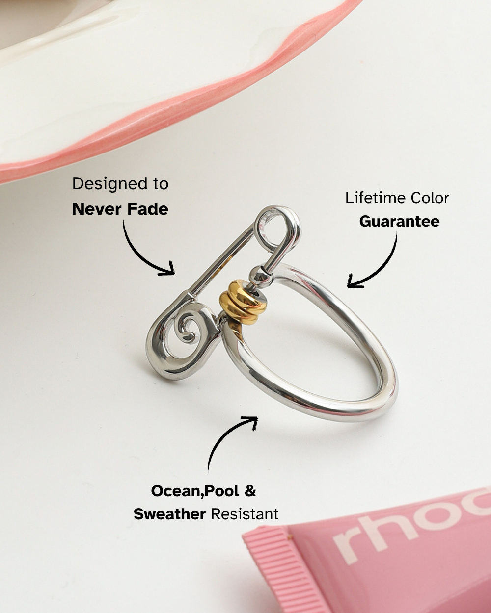 Silver ring with gold accent on a white background, featuring text about product features.