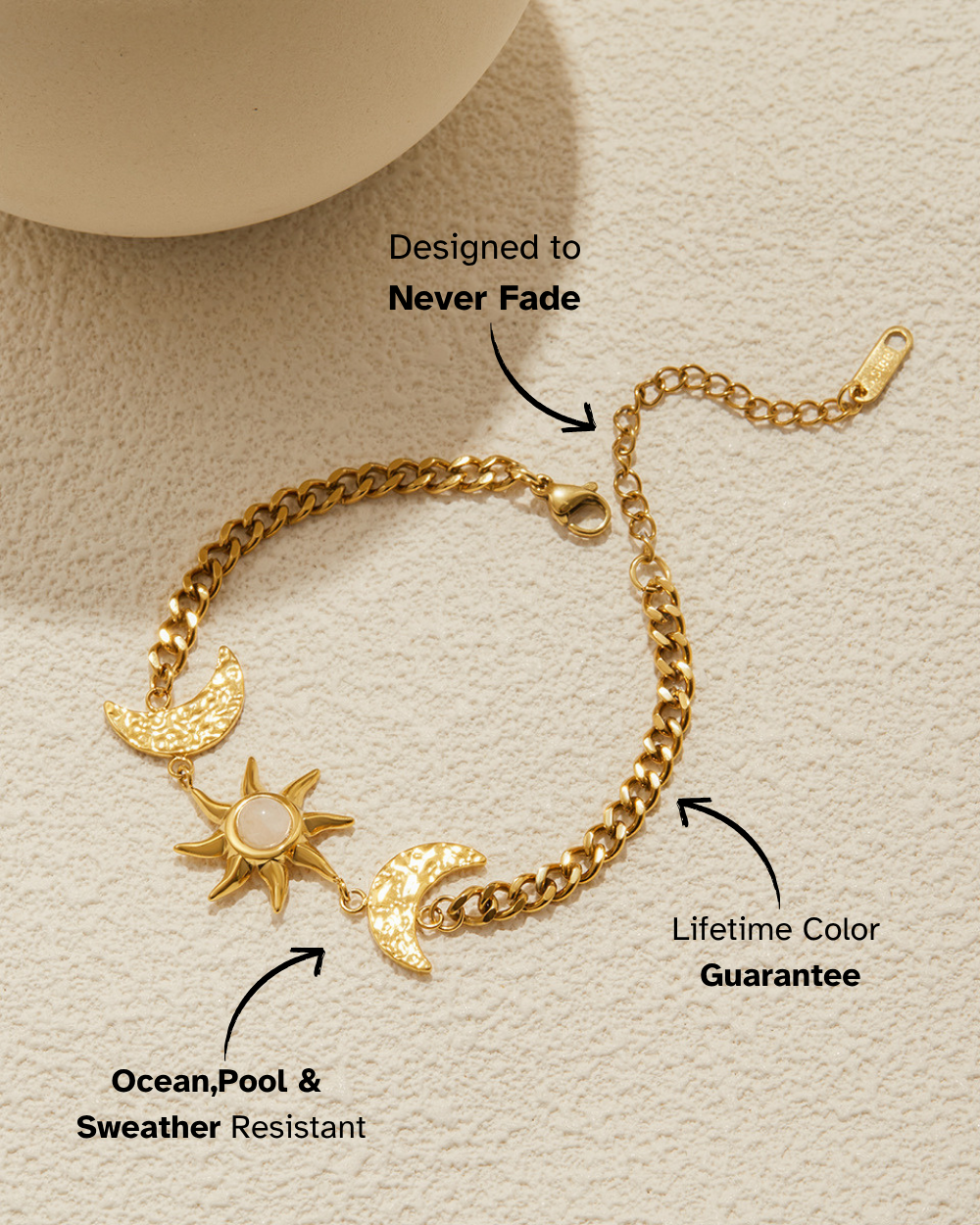Gold bracelet with charms on a beige background, featuring text about durability and color guarantee.
