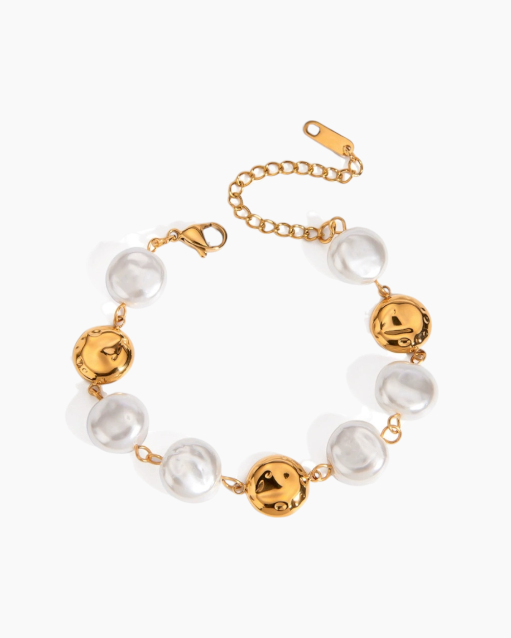 Gold and pearl bracelet on a white background