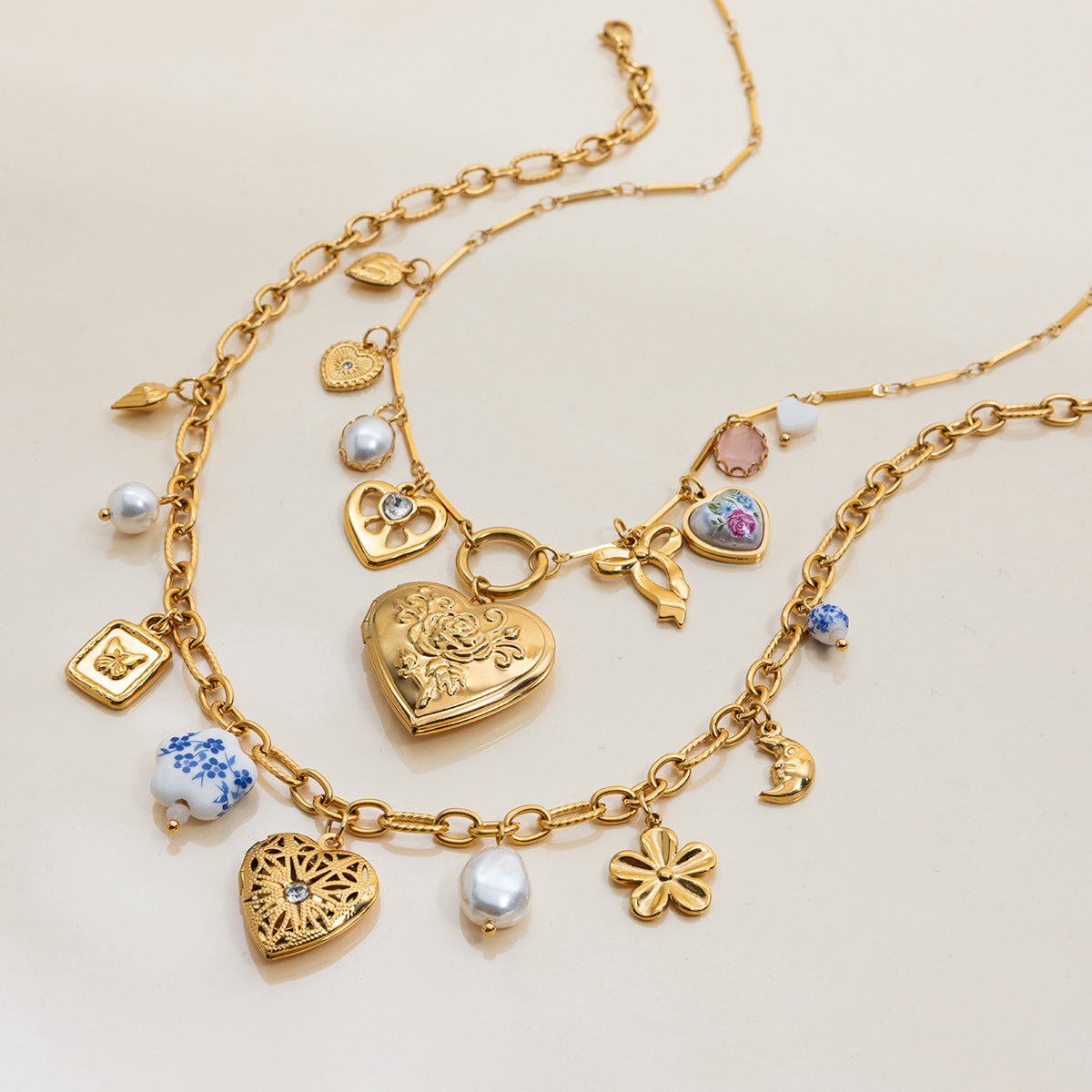 Adjustable chain closure detail of double-layered gold charm necklaces