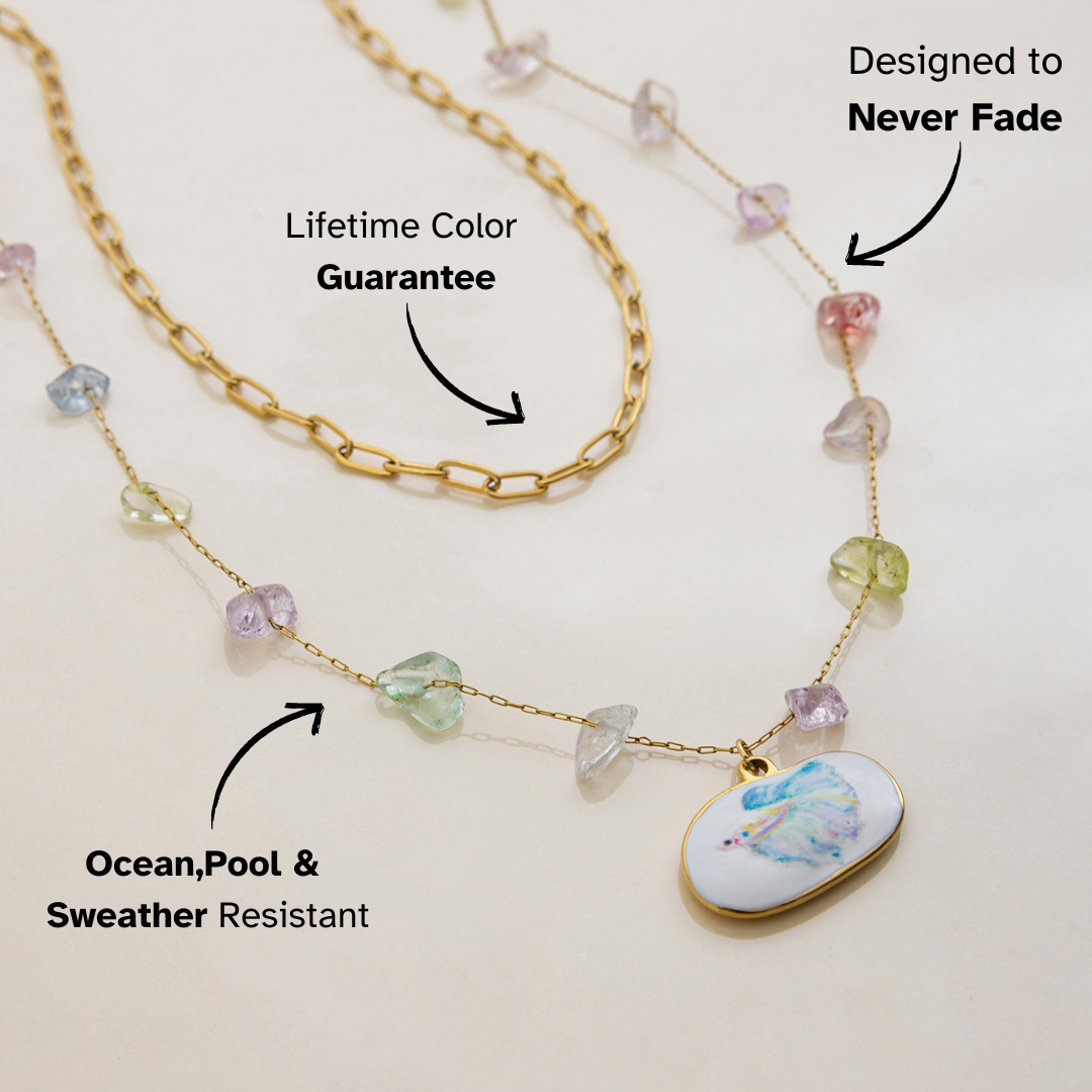 Double-layer necklace featuring gold chain and multicolor stones with betta fish pendant