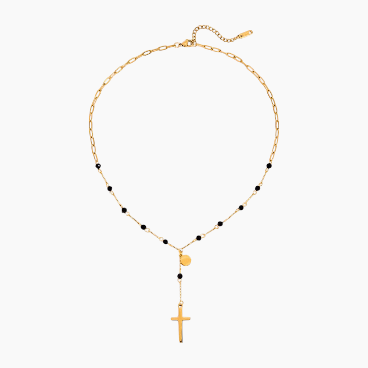 Gold necklace with black beads and a cross pendant on a white background