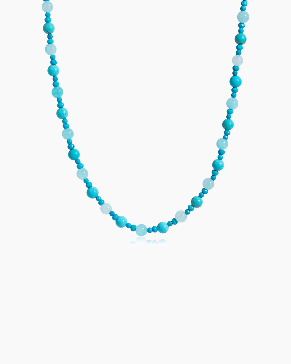 Necklace with blue and white beads on a white background