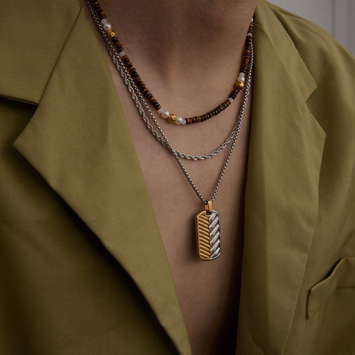 unisex metal tag necklace styled with blazer outfit