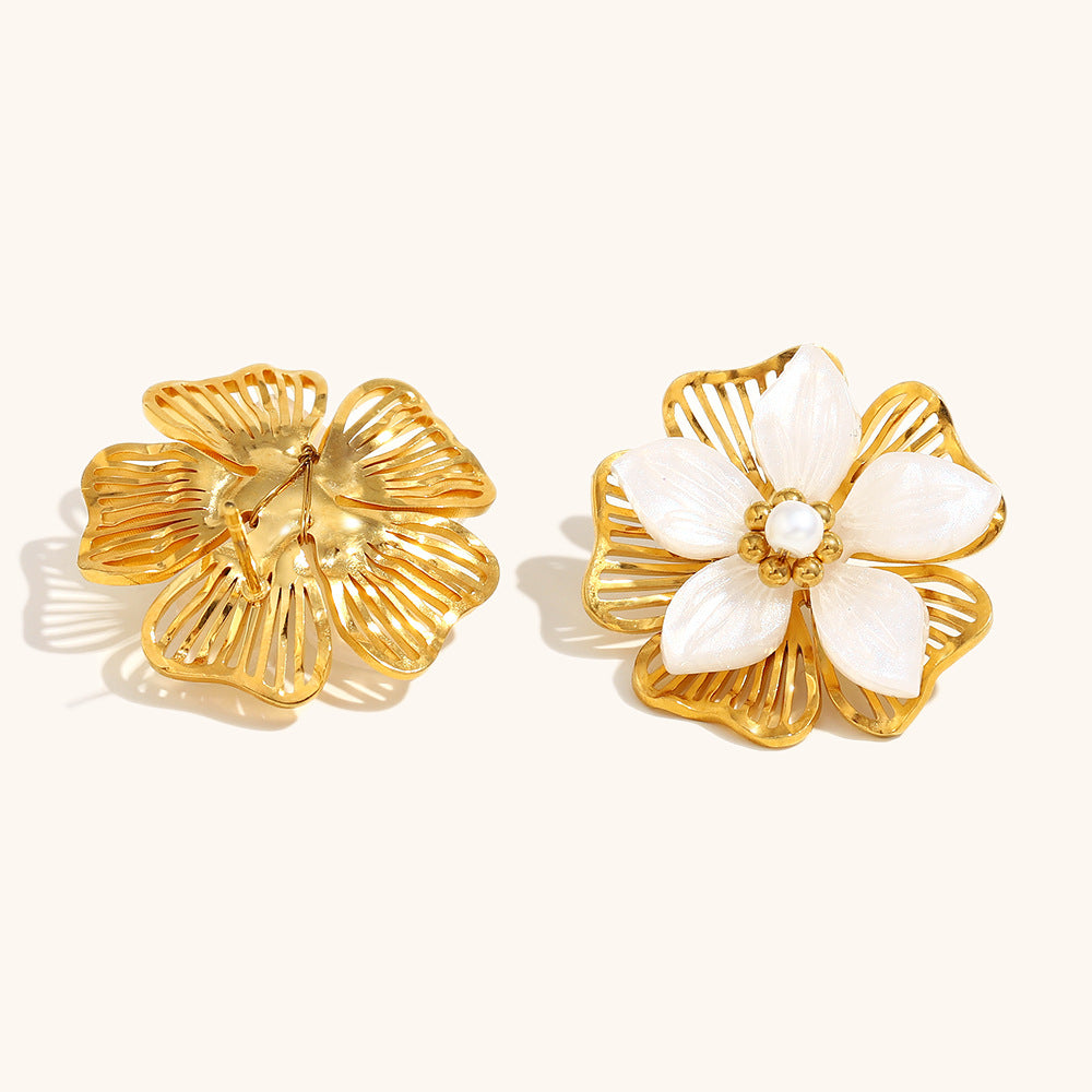 back and front view of large gold-tone earrings with openwork petals