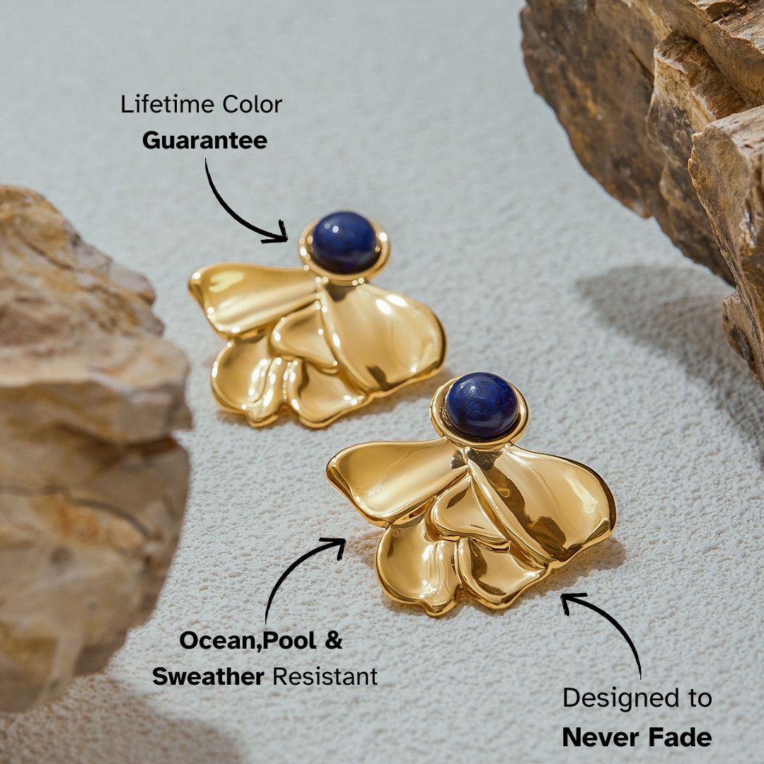 Statement gold earrings with lapis gemstone close-up