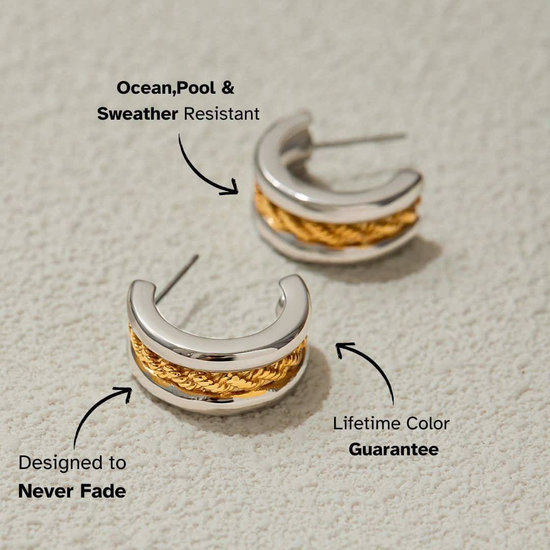 Close-up of gold and silver braided hoop earrings on textured background