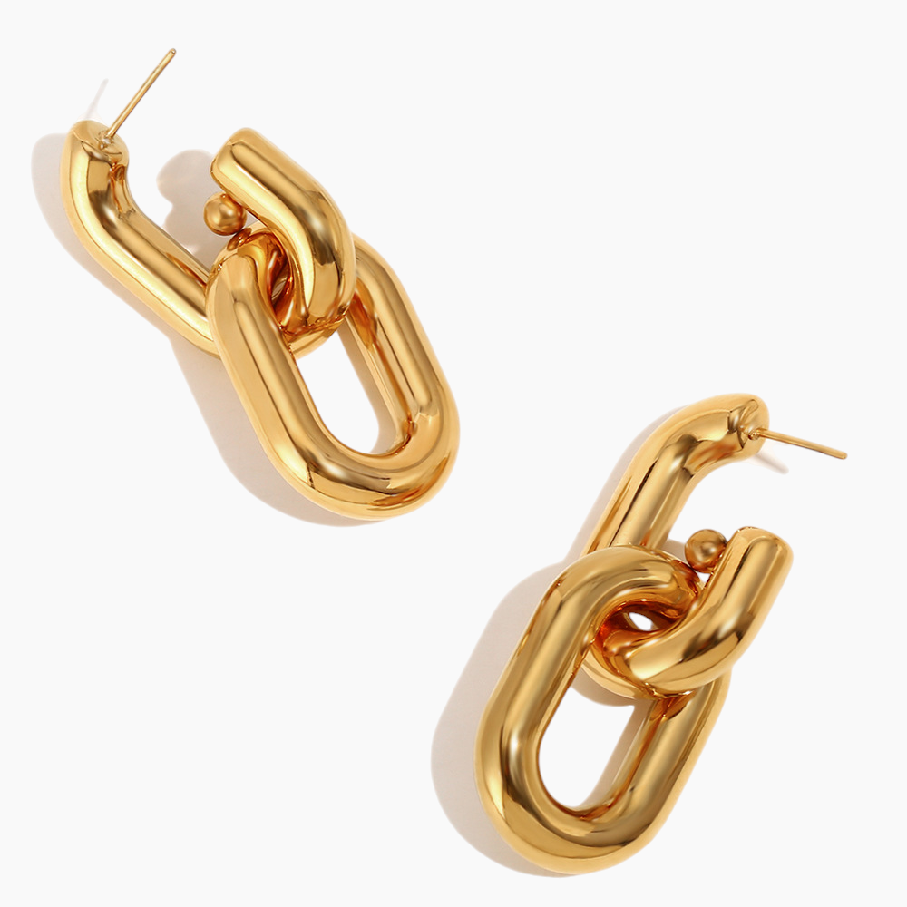 Gold chain-link hoop earrings on a white background