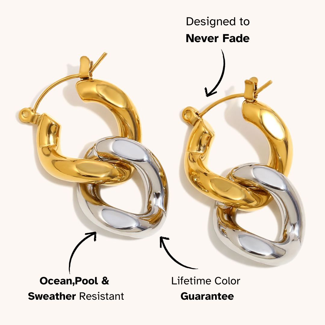 Chunky mixed-metal hoop earrings in gold and silver, styled for statement looks in edgy London streetwear.