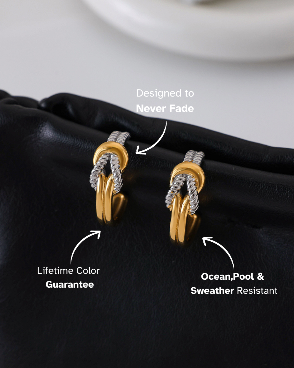 Gold earrings on a black surface with text highlighting features.
