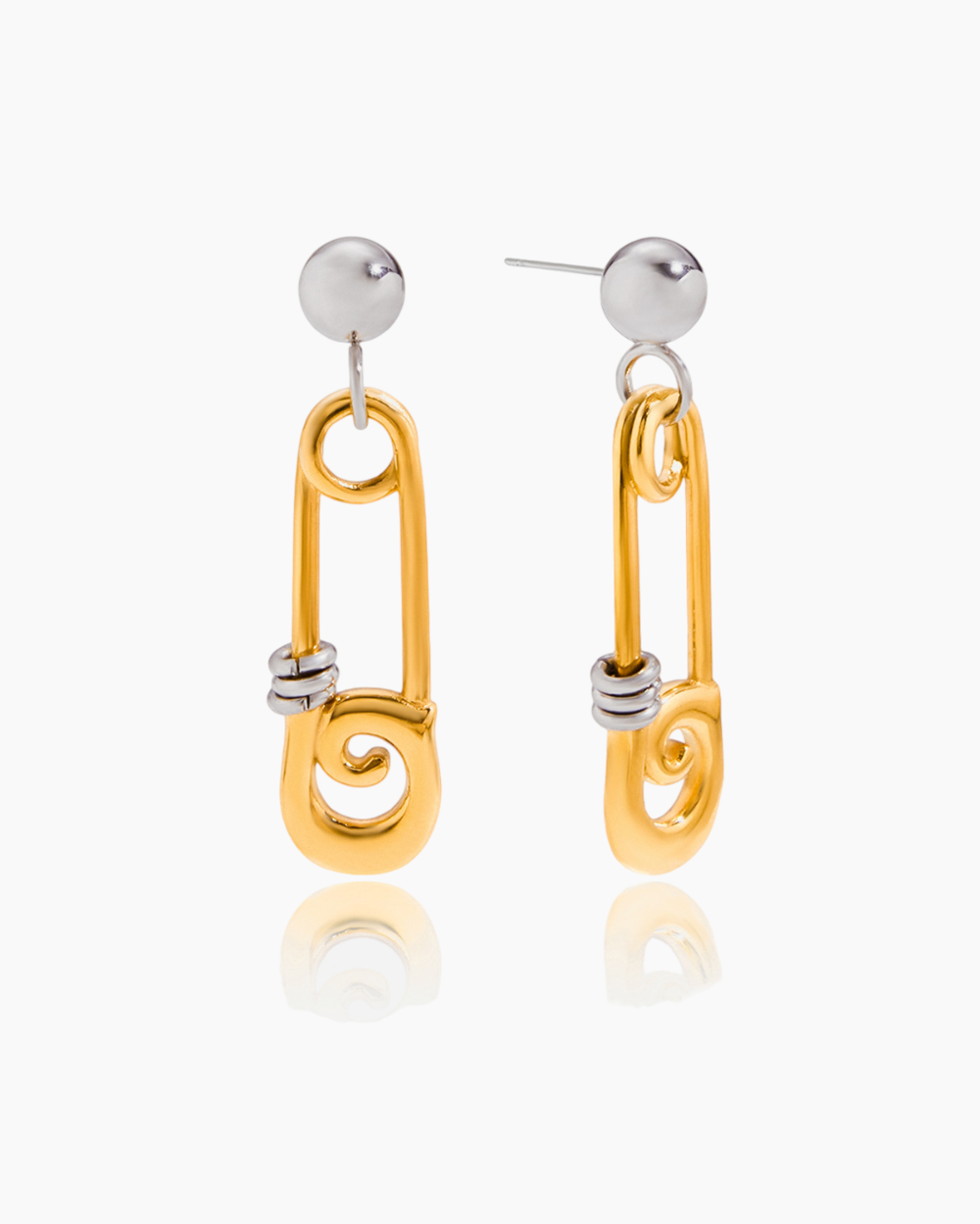 Gold and silver spiral earrings on a white background