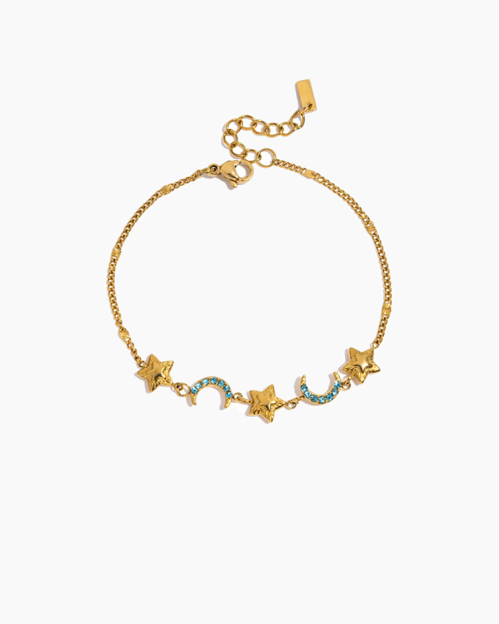 Gold bracelet with star and moon charms on a white background