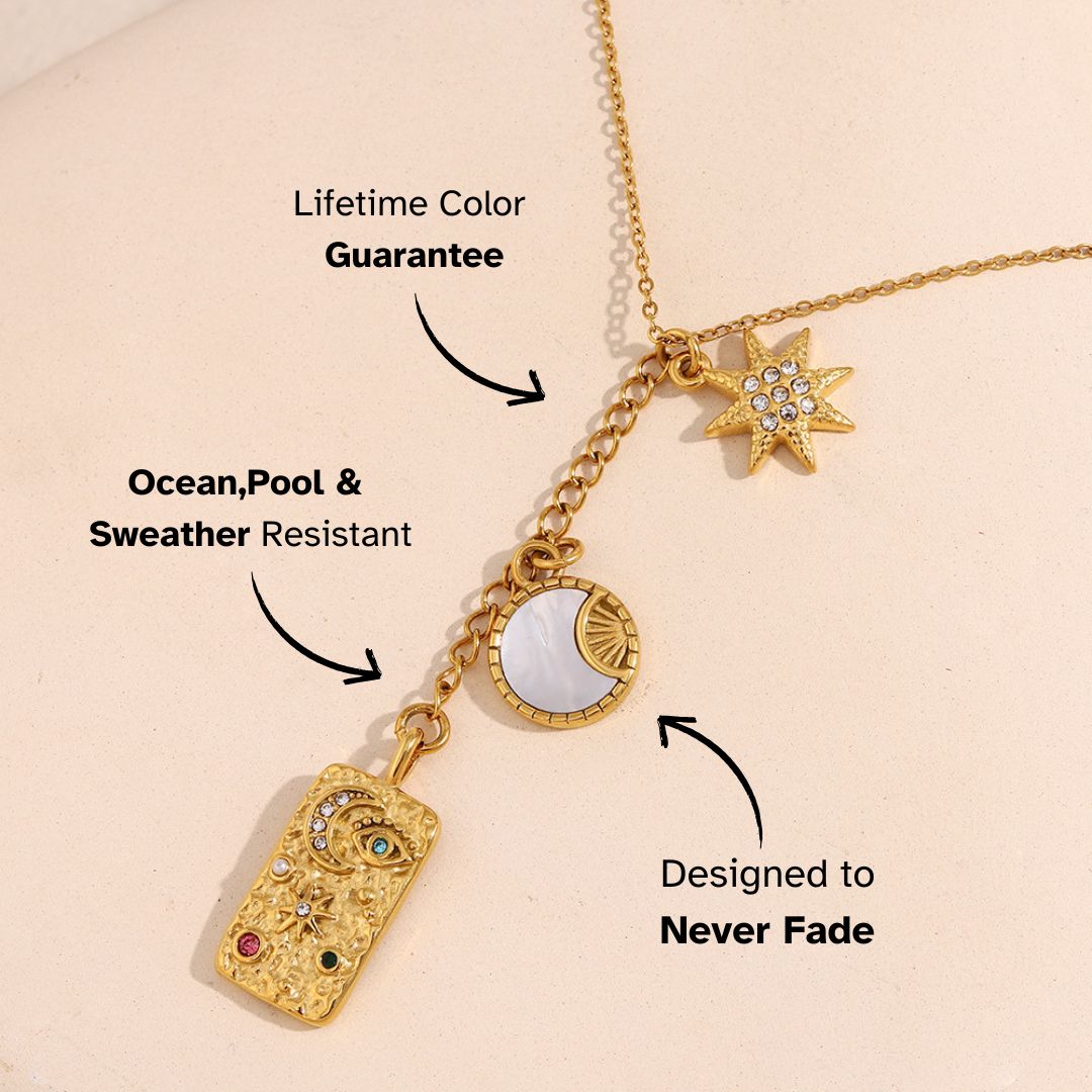 Astrology-inspired necklace with moon, star and engraved plate charms, dreamy and mystical vibe.