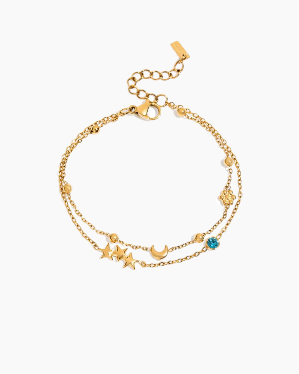 Gold bracelet with star and moon charms on a white background