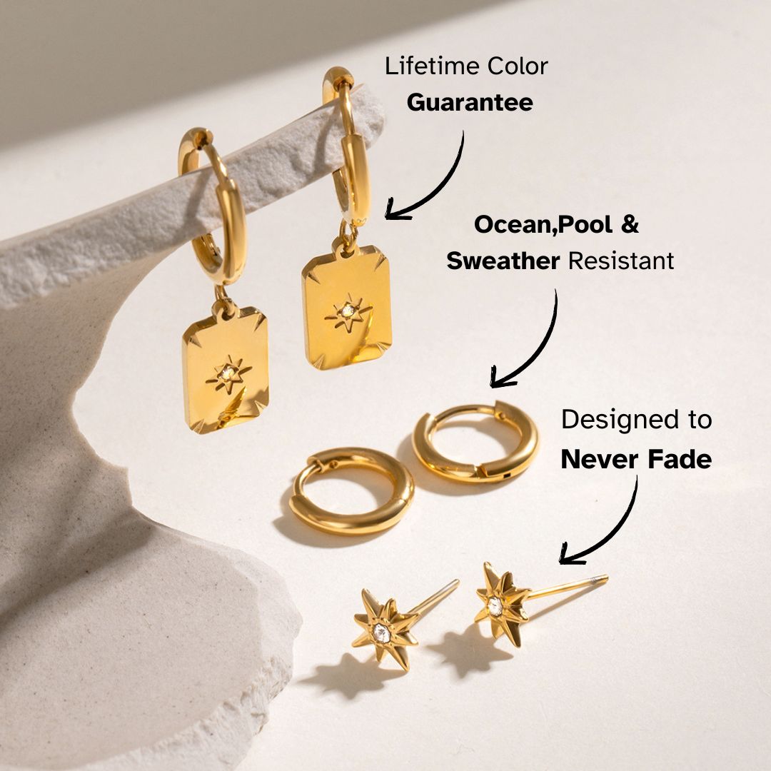 Flat lay of three-pair gold earrings set featuring sunburst studs and geometric tags