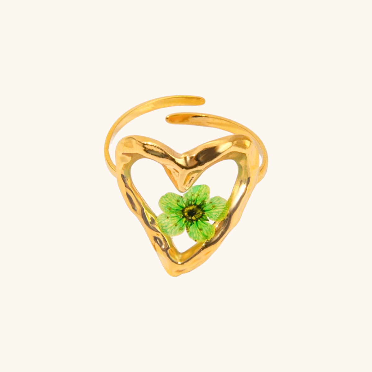 Open heart-shaped gold ring with embedded four-leaf clover for good luck