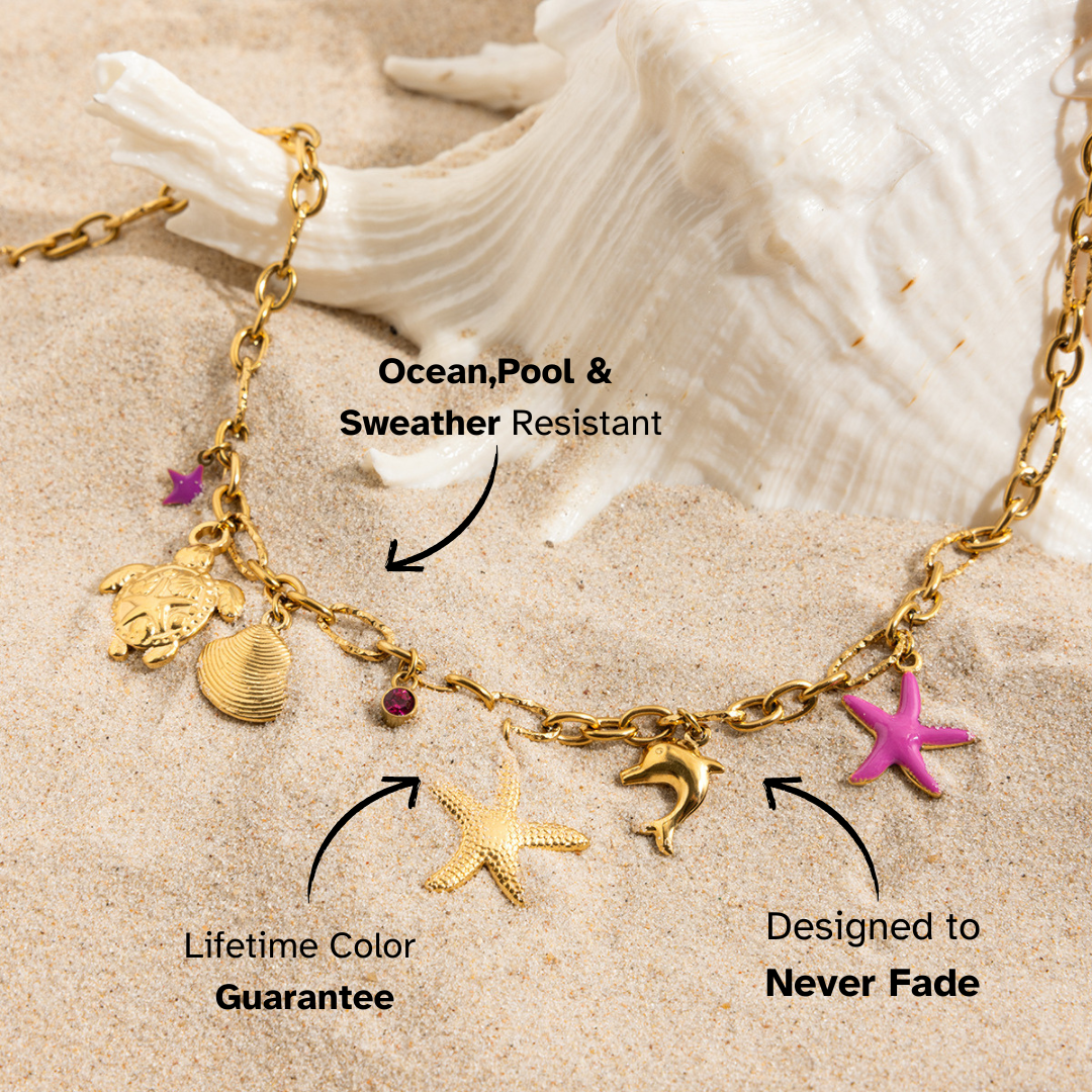 Sea-themed pendant necklace with tropical charms on sand