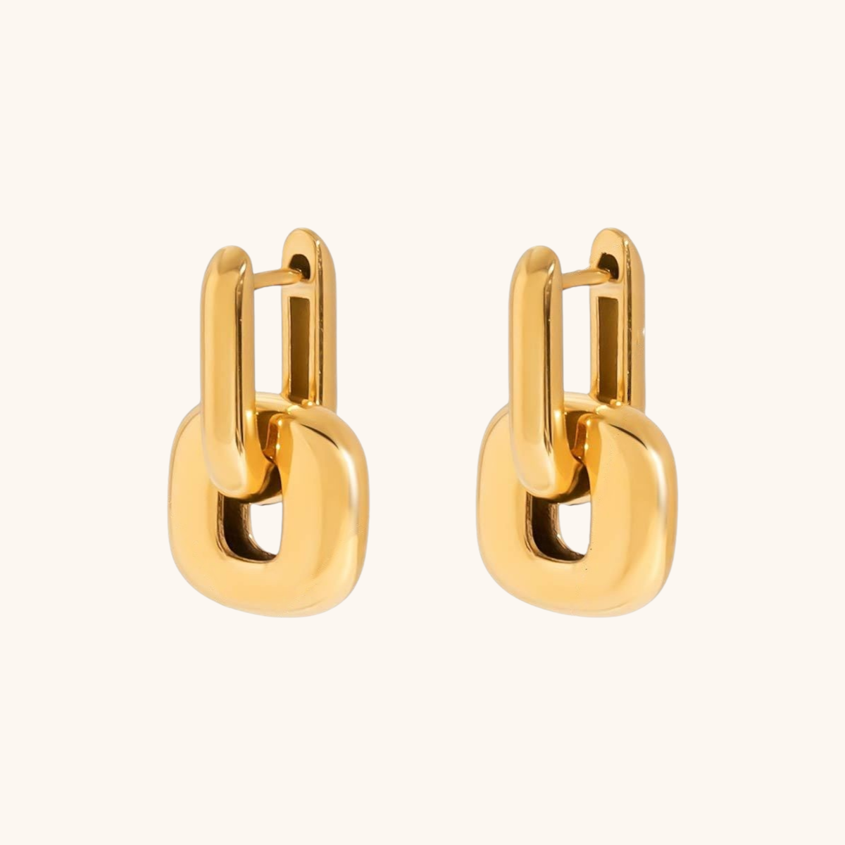 Collection of four gold and silver chunky earrings hanging outdoors, labeled waterproof and fadeproof.