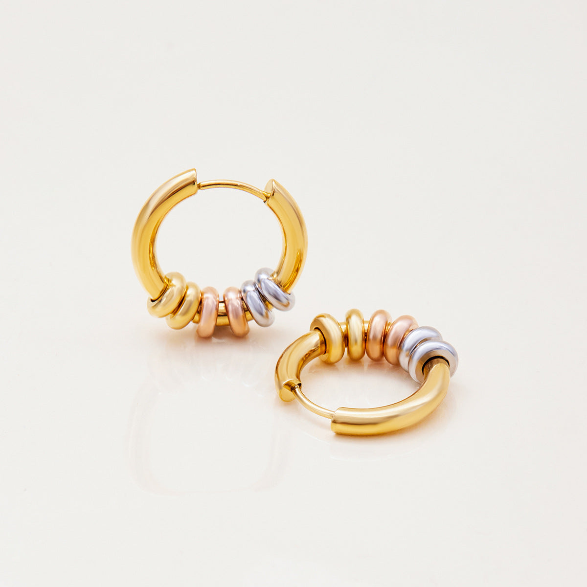 Statement gold hoops with mixed metal beads
