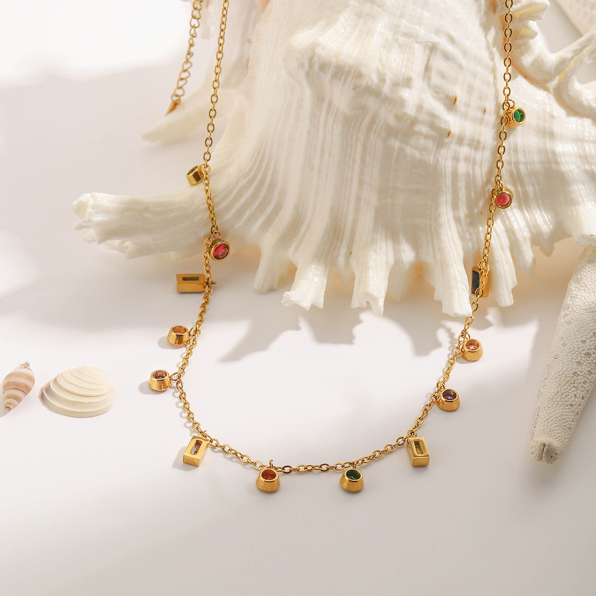 Gold chain necklace with colorful round and rectangular cubic zirconia