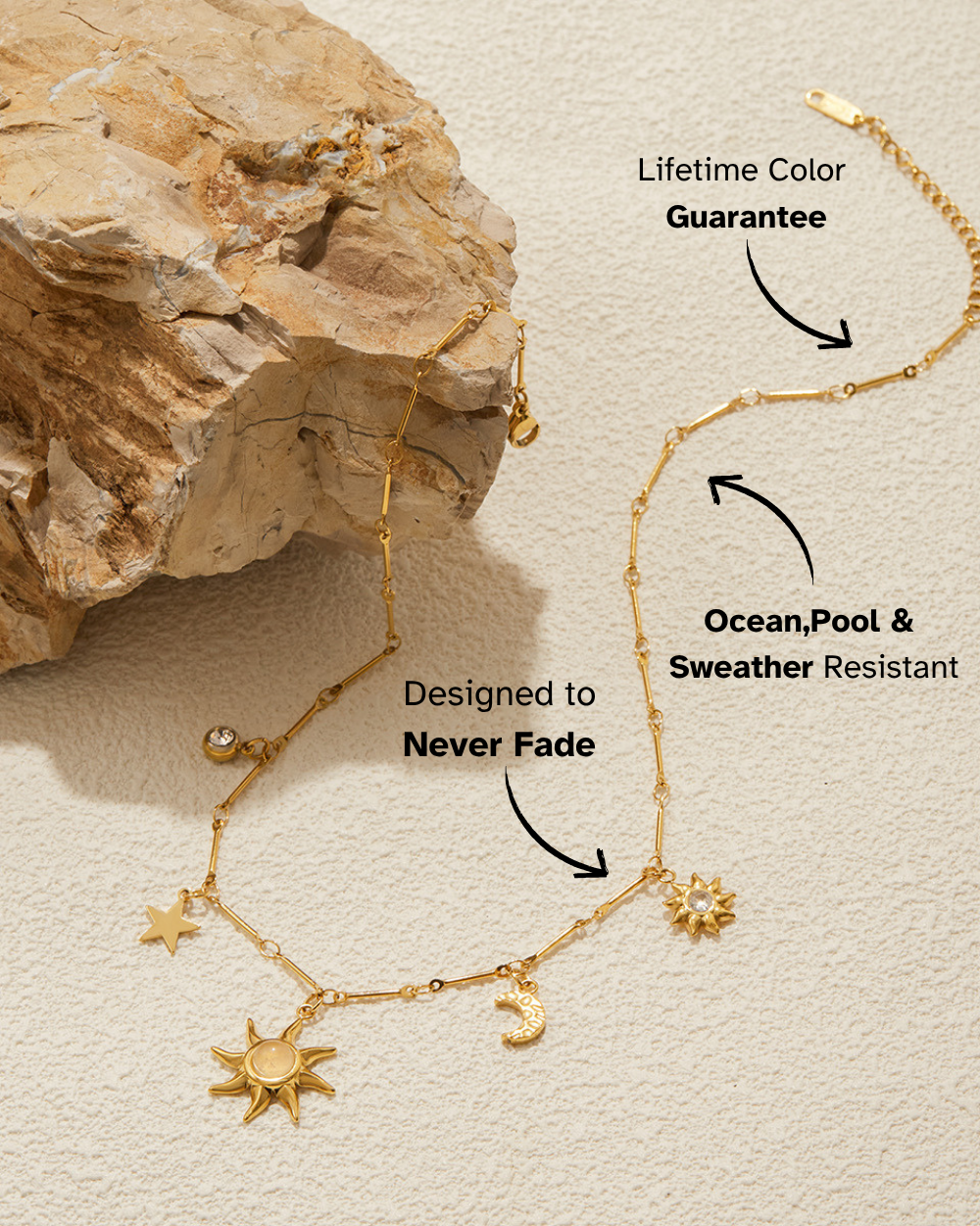 Gold necklace with star and moon charms on a textured beige background
