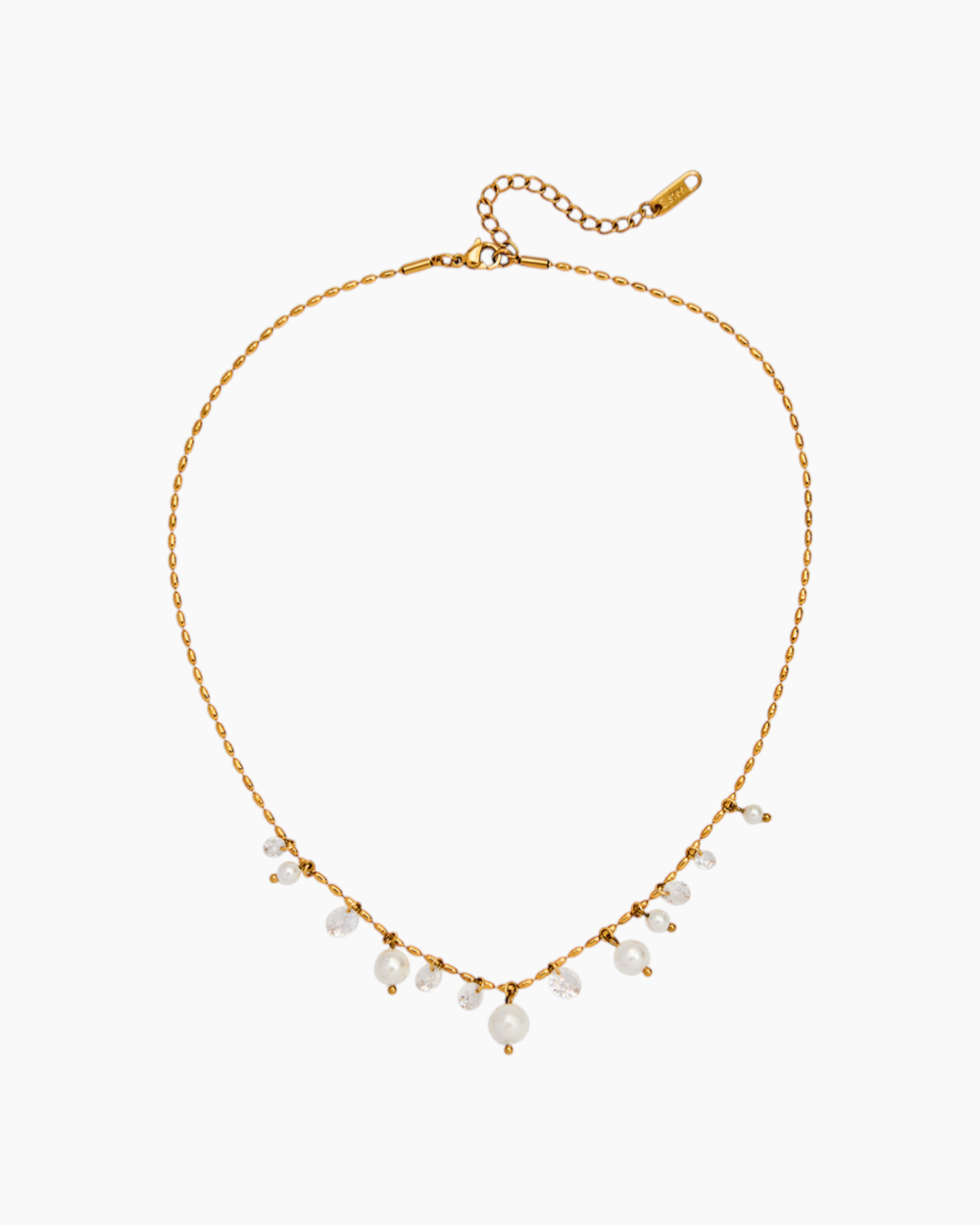 Gold necklace with small pearls on a white background