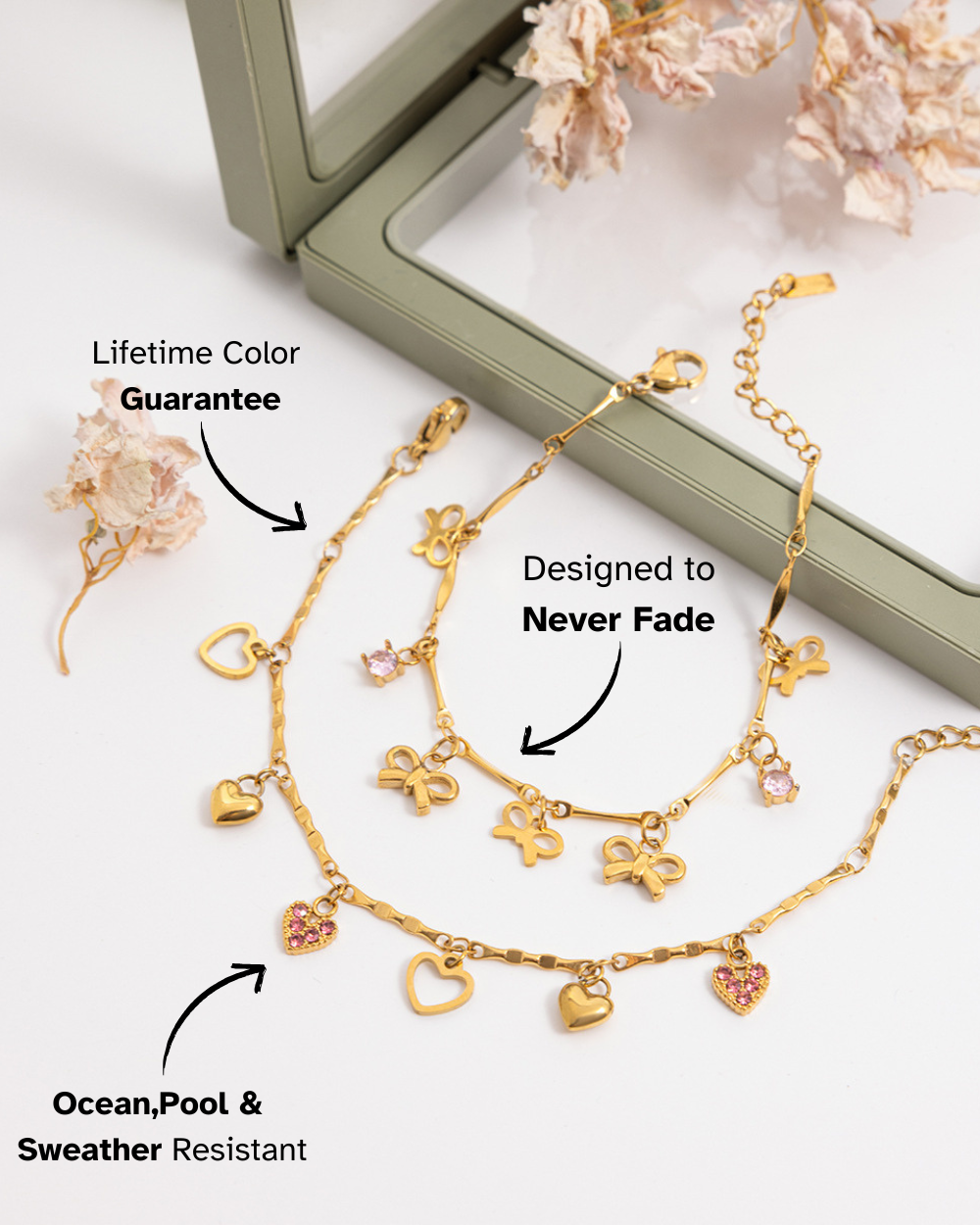 Gold bracelet with heart and flower charms on a white surface with text about color guarantee and resistance.