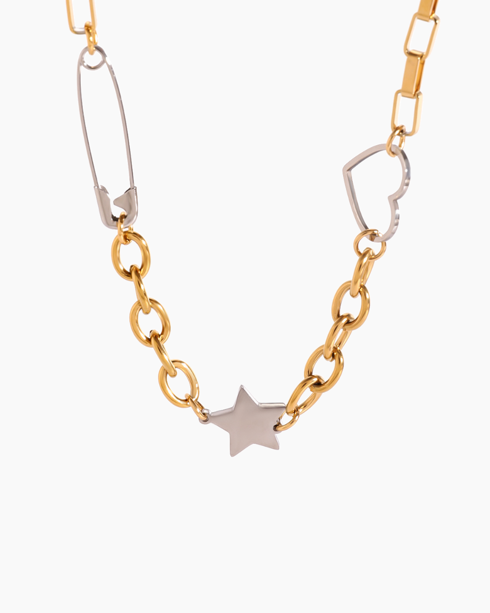 Gold and silver chain necklace with a star pendant on a white background