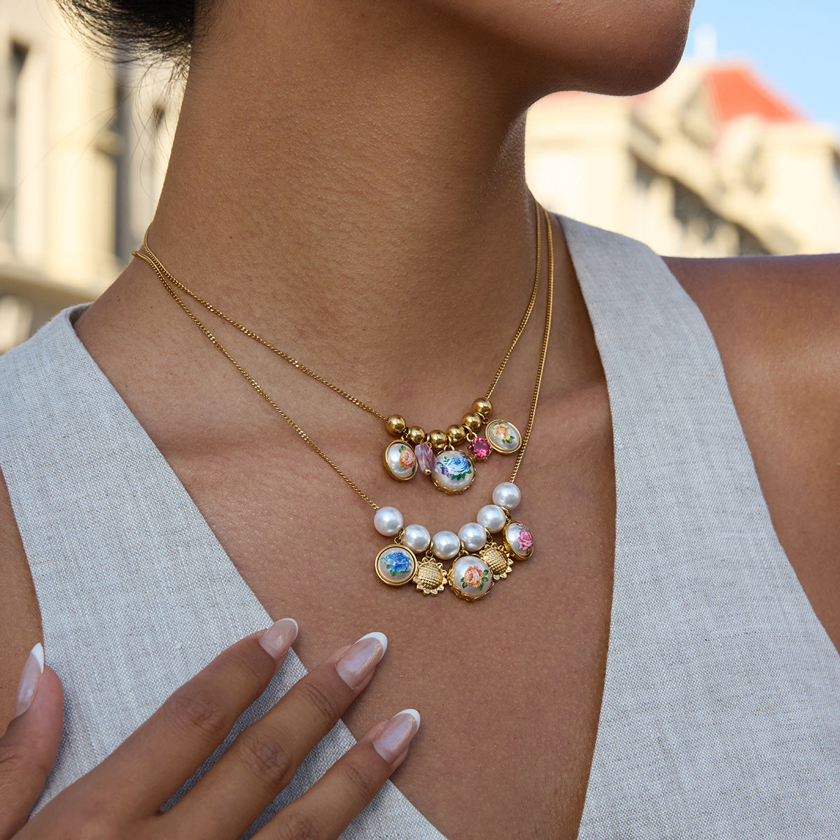 Close-up of a woman wearing a colorful beaded necklace with a blurred background