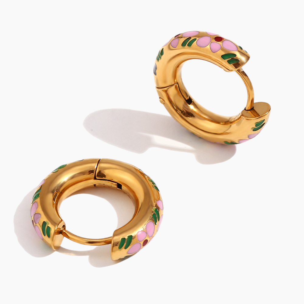 Gold hoop earrings with colorful floral designs on a white background