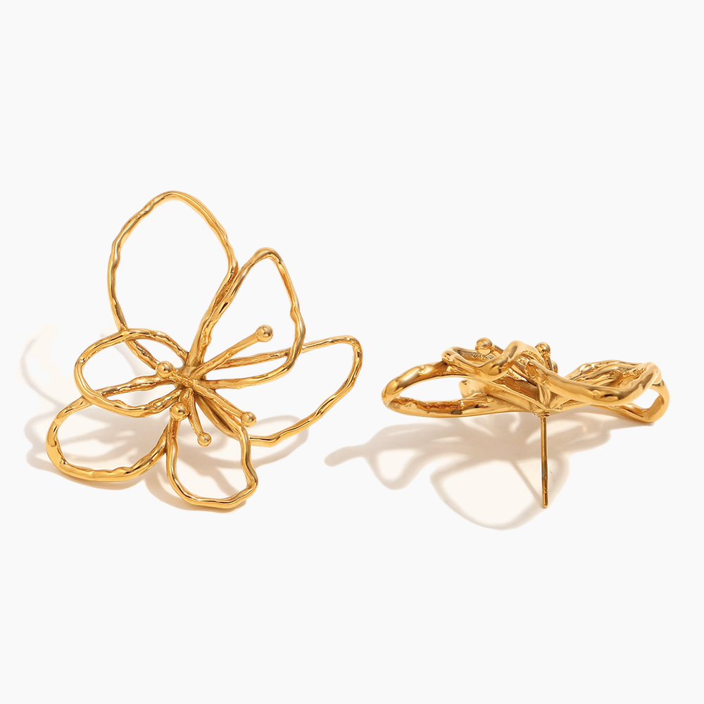 Gold butterfly-shaped earrings on a white background