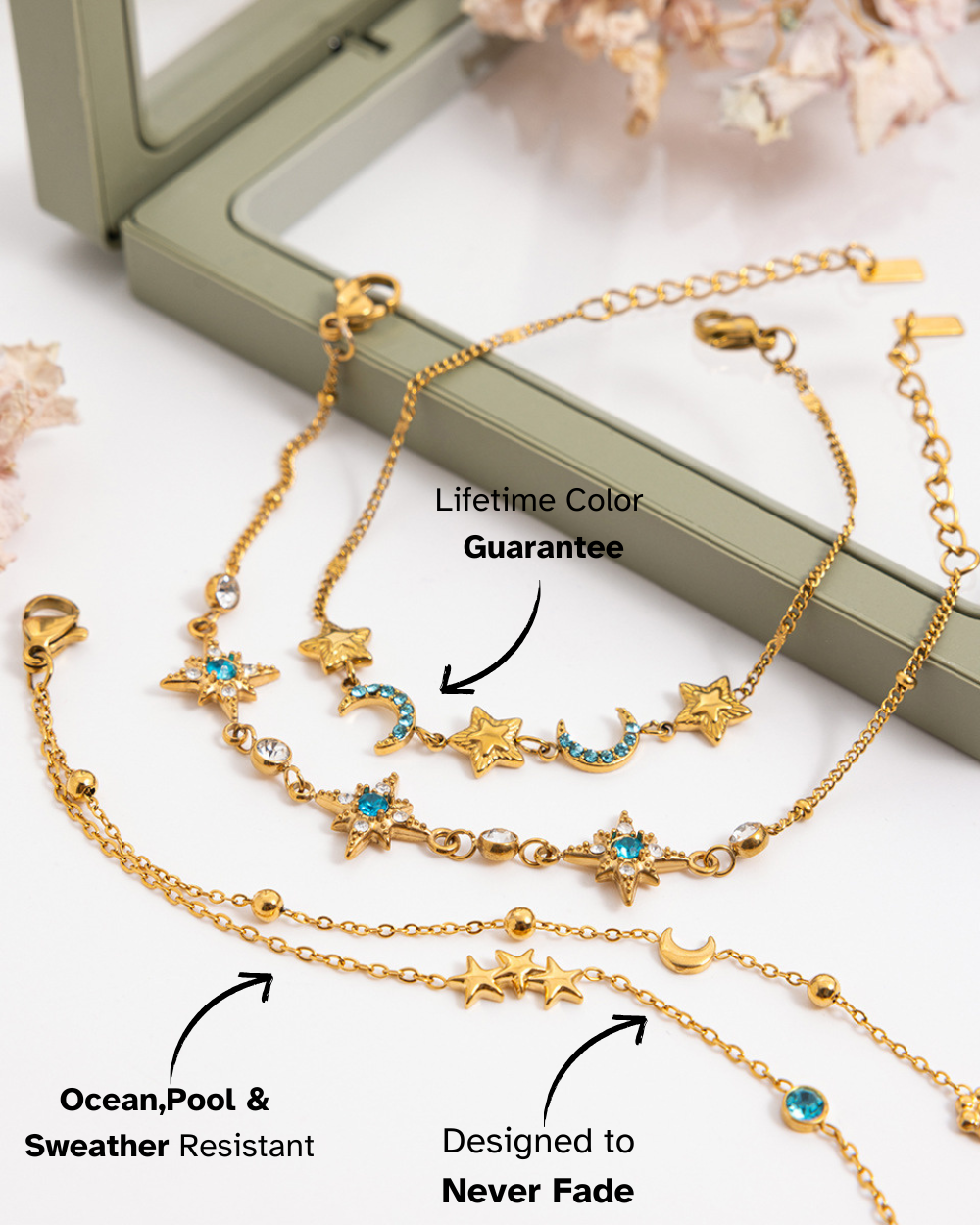 Gold bracelet with star and moon designs on a white surface with text about color guarantee and weather resistance.