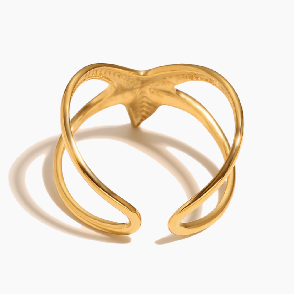 Ocean inspired starfish ring paired with layered seaside jewelry