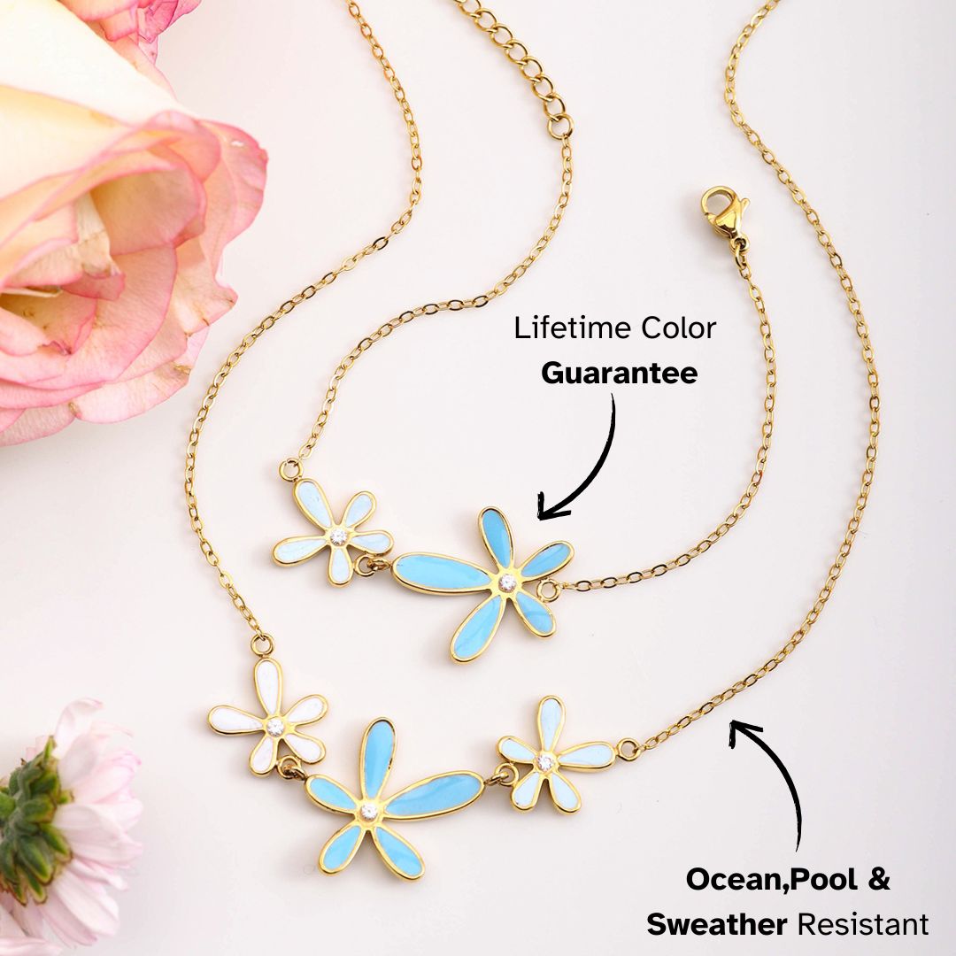 Blue and white enamel flower pendant necklaces styled with pastel roses