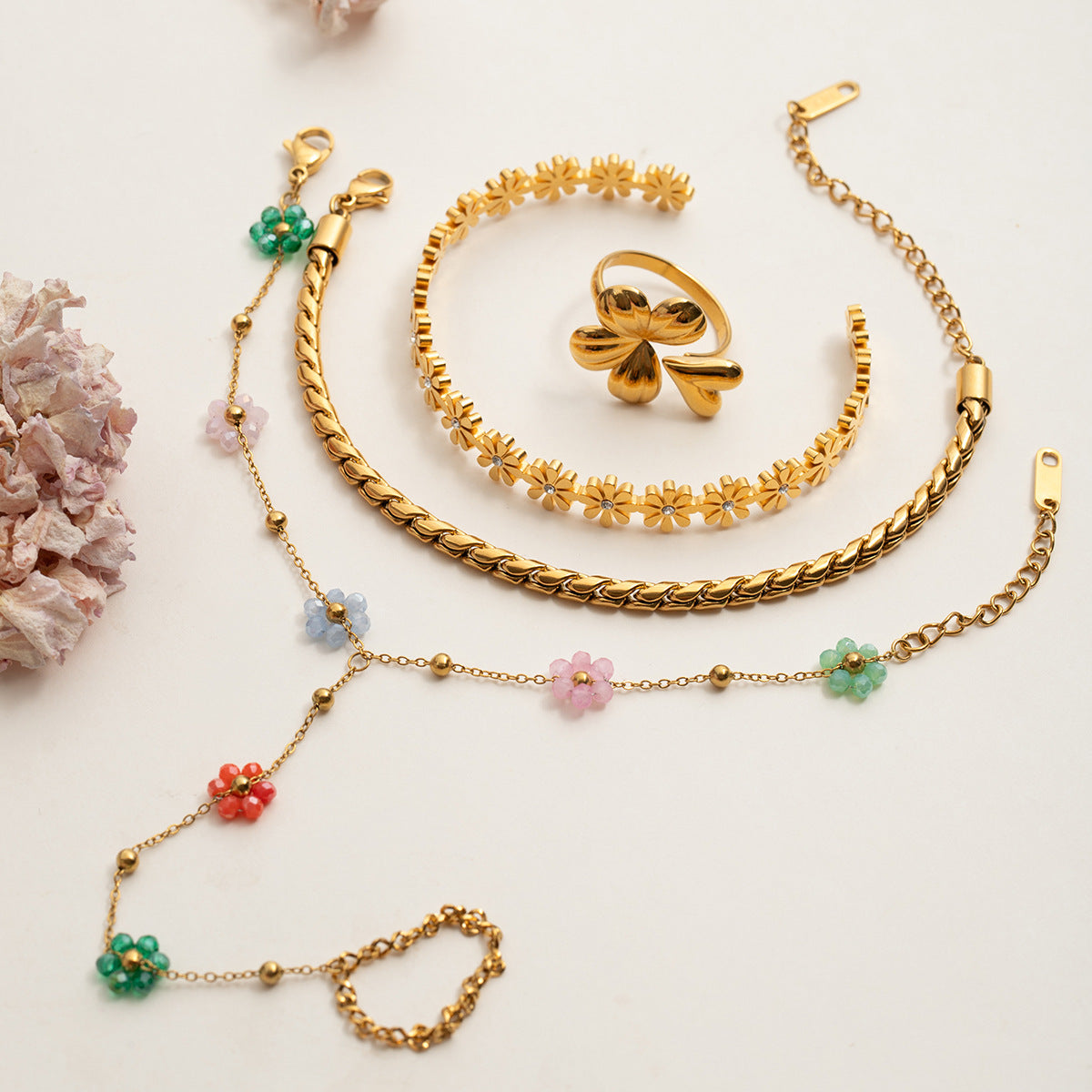 Waterproof gold floral hand bracelet styled with picnic outfit in sunny garden