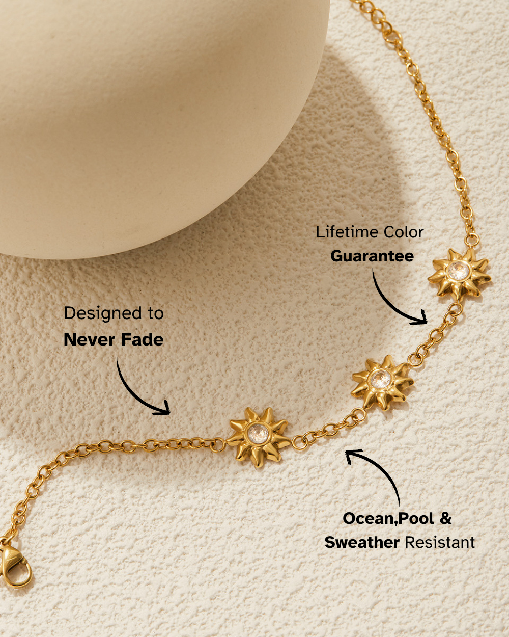 Gold bracelet with star designs on a beige background, featuring text about color guarantee and water resistance.