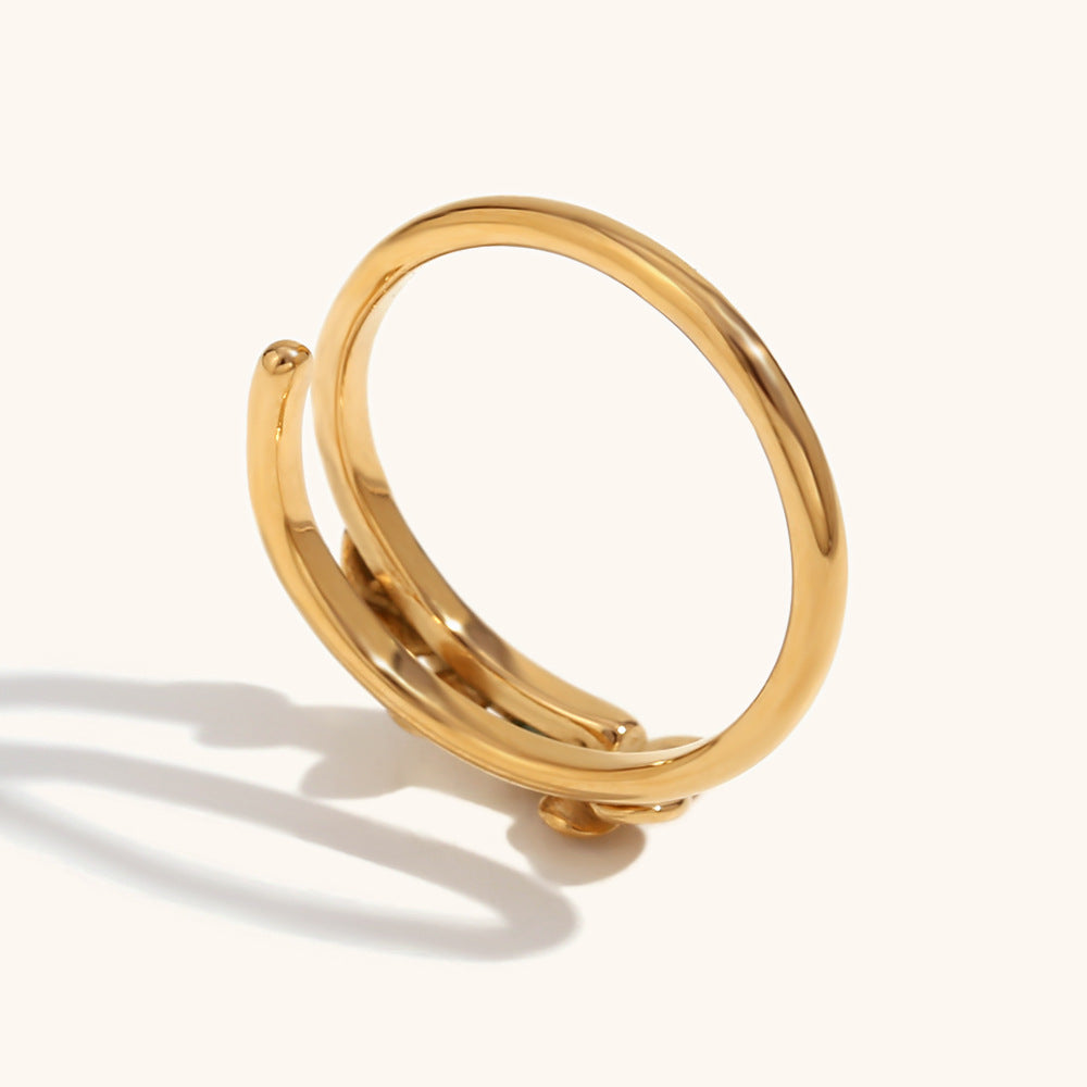Shiny gold ring with engraved floral details, lightweight and dainty for daily wear