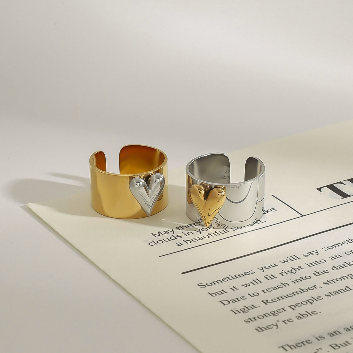 Stylish heart design open ring placed on minimalistic magazine