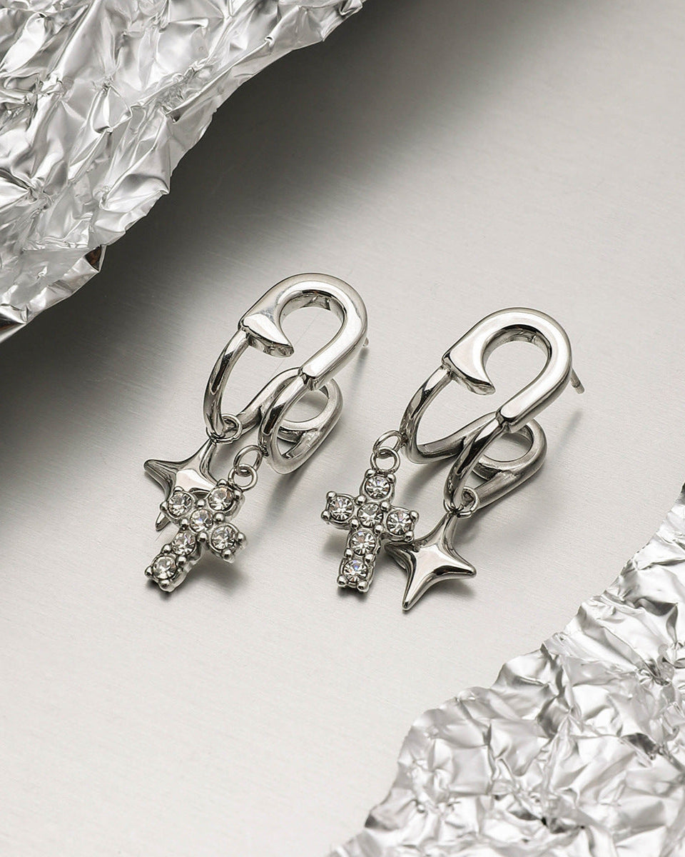 Stylish silver dangle earrings with punk-style safety pin design and cubic zirconia