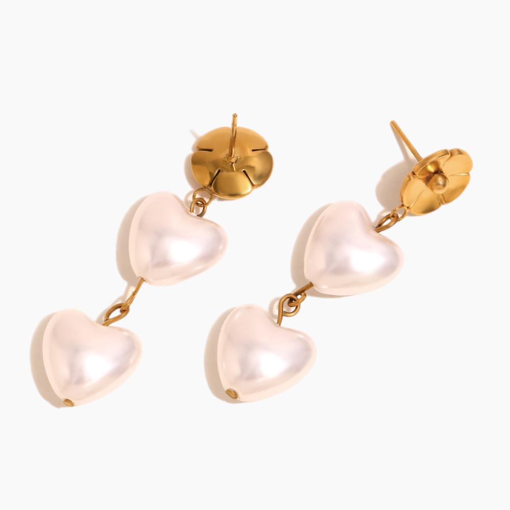 Heart-shaped earrings with gold accents on a white background