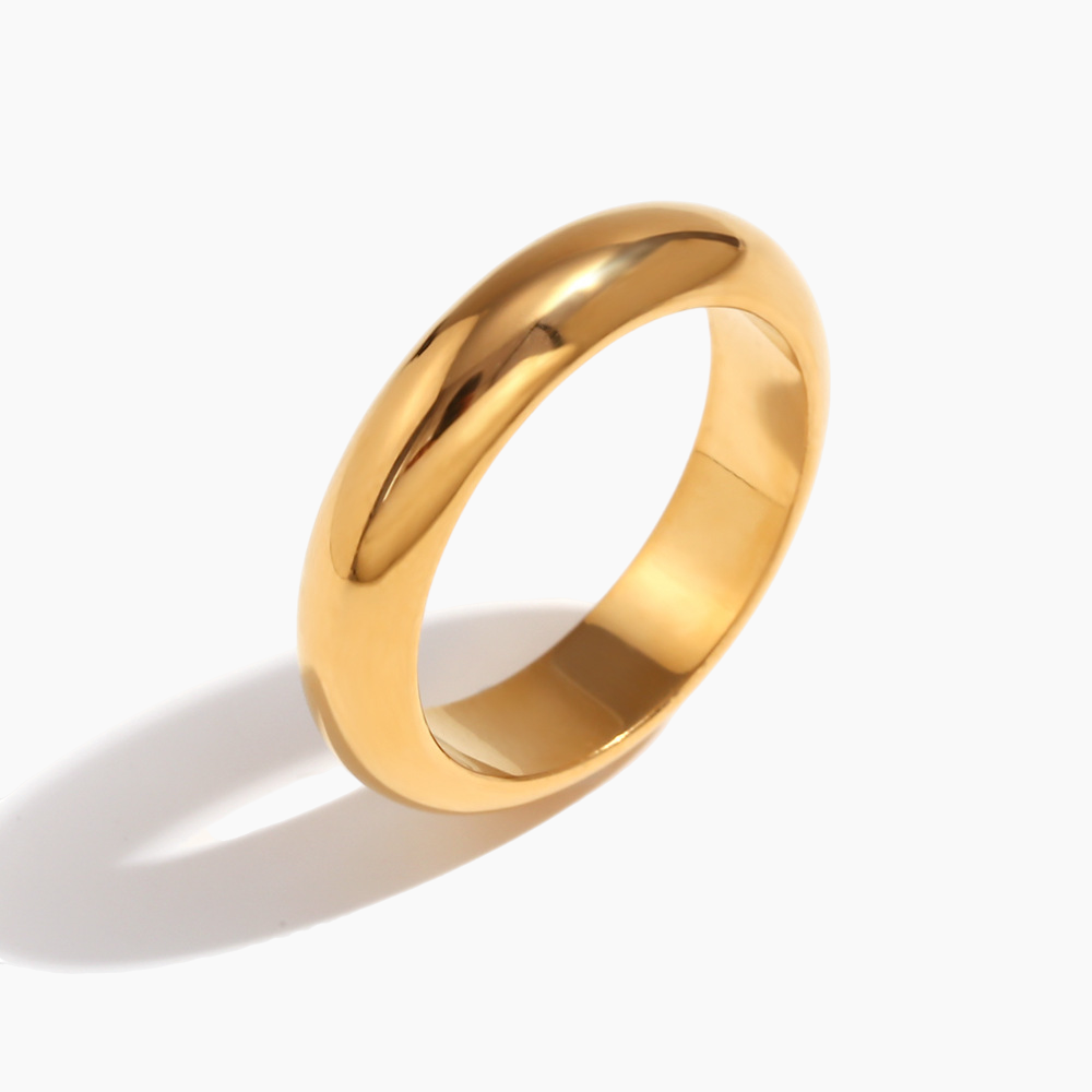 Flat-lay styling of the dome ring with casual outfit accessories