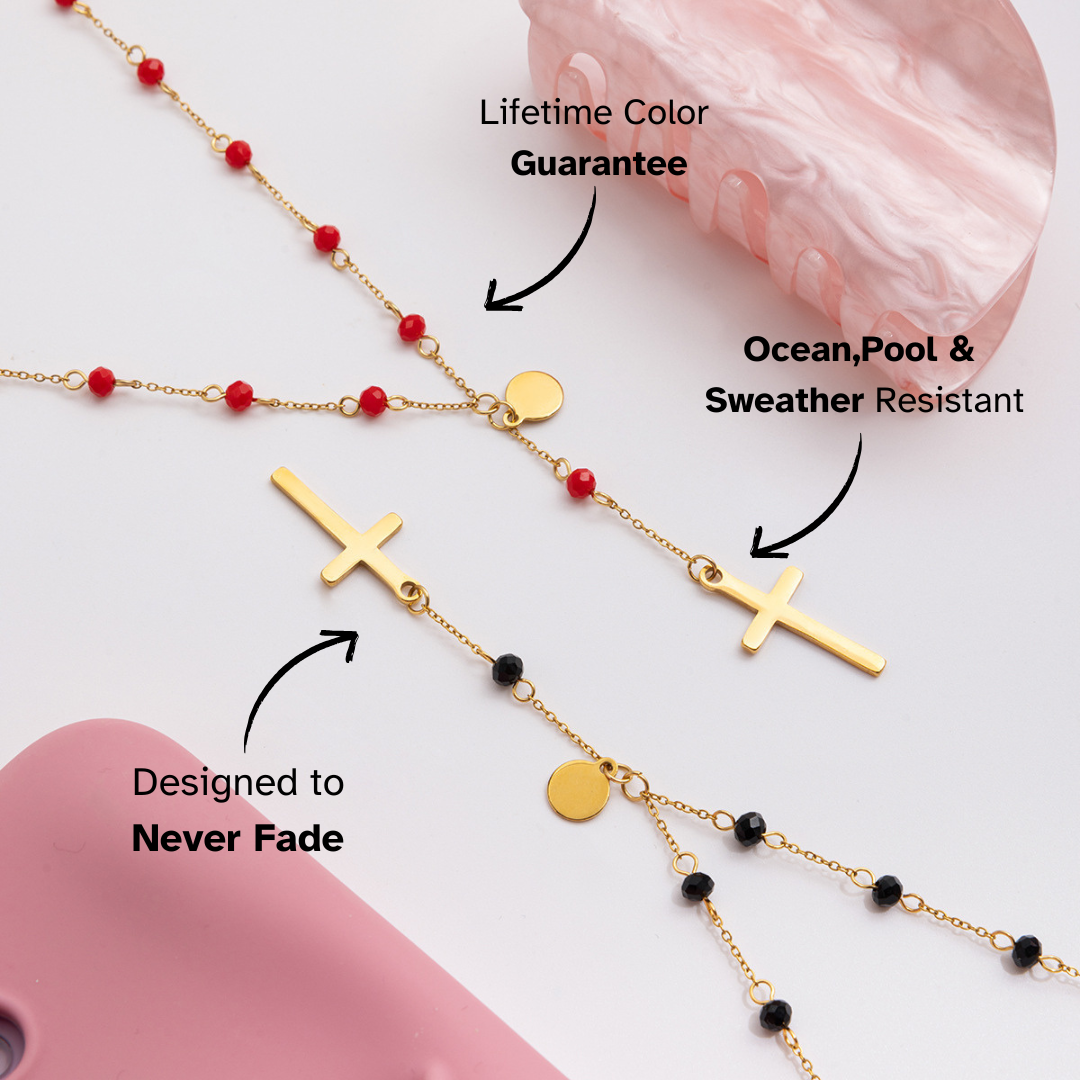 Gold necklace with red and black beads on a pink background, featuring text about product features.