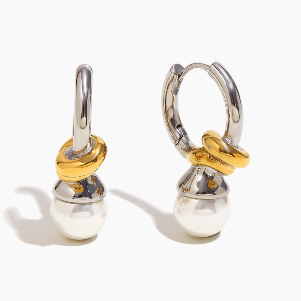 Pearl hoop earrings with knot design layered with delicate studs
